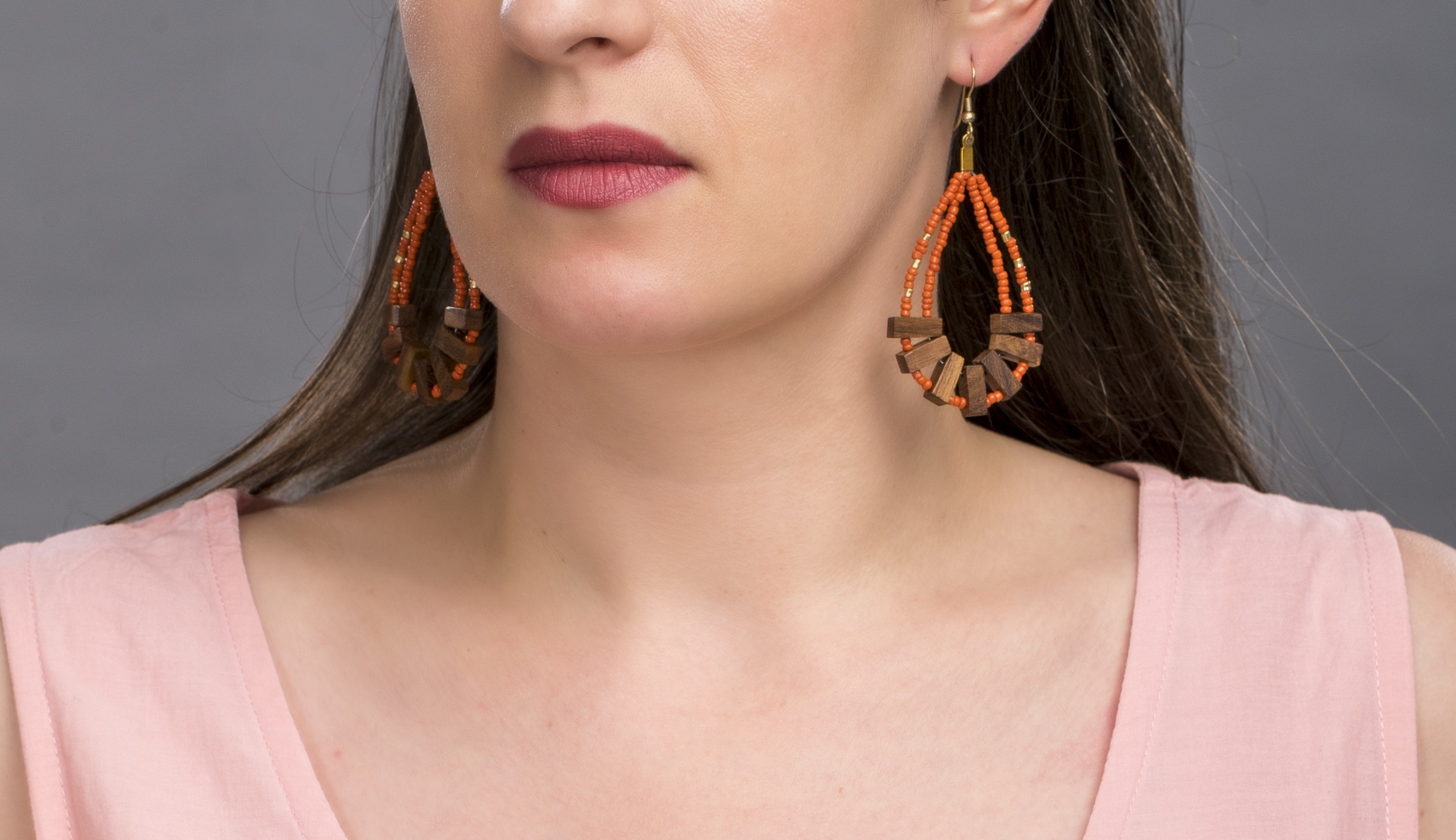 Mallika earrings Statement drop earrings that are rustic and daring. An unusual combination of rust coloured glass beads and dark wood.