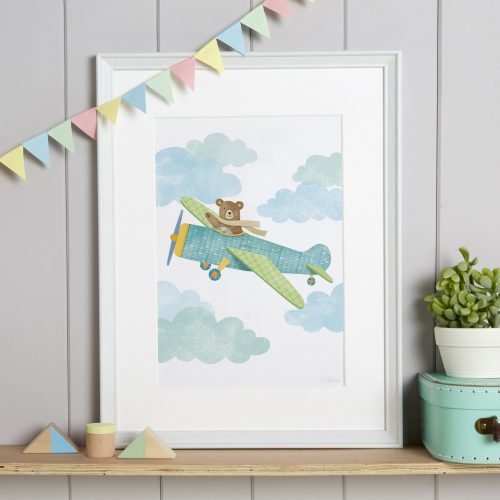 Nursery art print of a bear flying an aeroplane