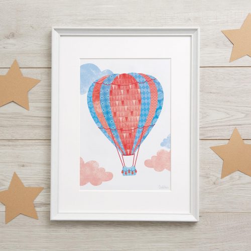 Lifestyle image of a framed hot-air balloon nursery picture