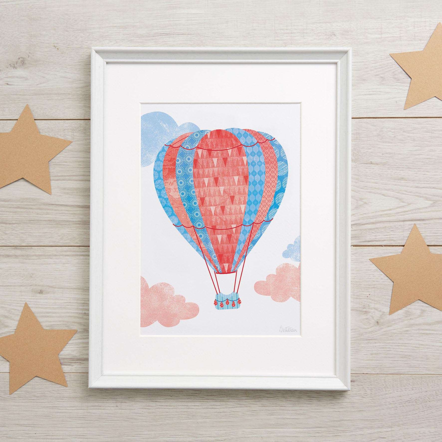 HOT_AIR_BALLOON_RED_Art_Print_A3_Stars_CREOATE Lifestyle image of a framed hot-air balloon nursery picture