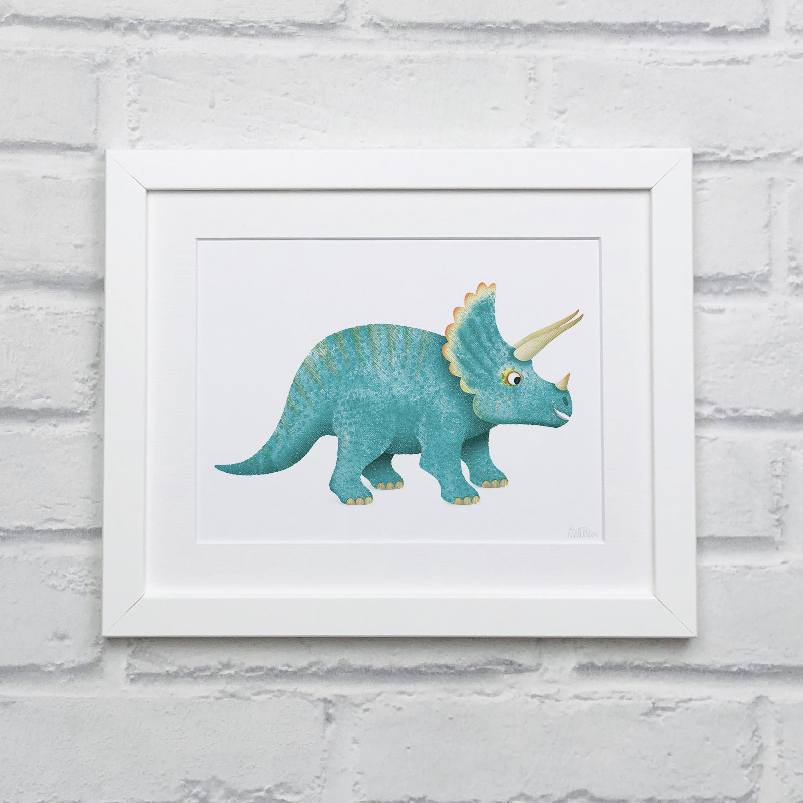TRICERATOPS_Art_Print_10x8_White_Brick_Wall_CREOATE Lifestyle image of a framed Triceratops print