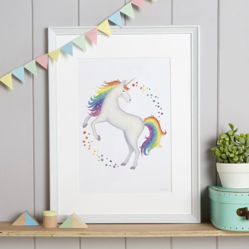 Lifestyle image of a framed rainbow unicorn picture
