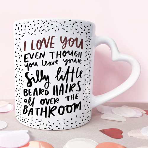 11oz ceramic mug with heart shaped handle that reads 