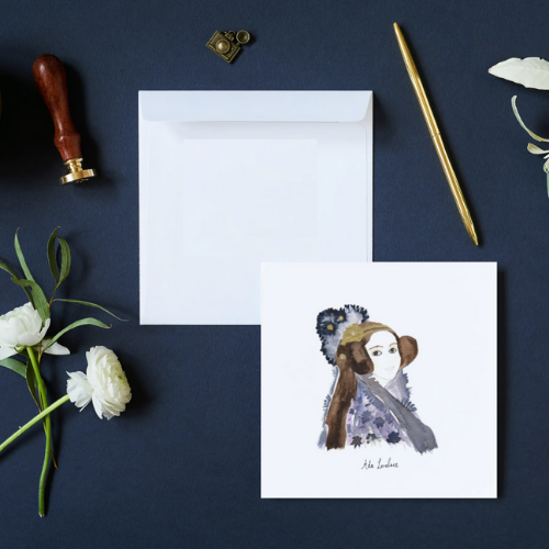 Ada Lovelace on a white background with envelope. Dark blue background with a stamp and white flowers