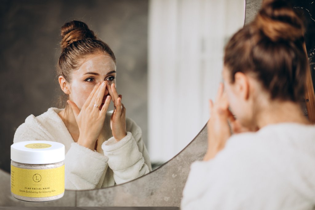 Woman at home applying cream mask