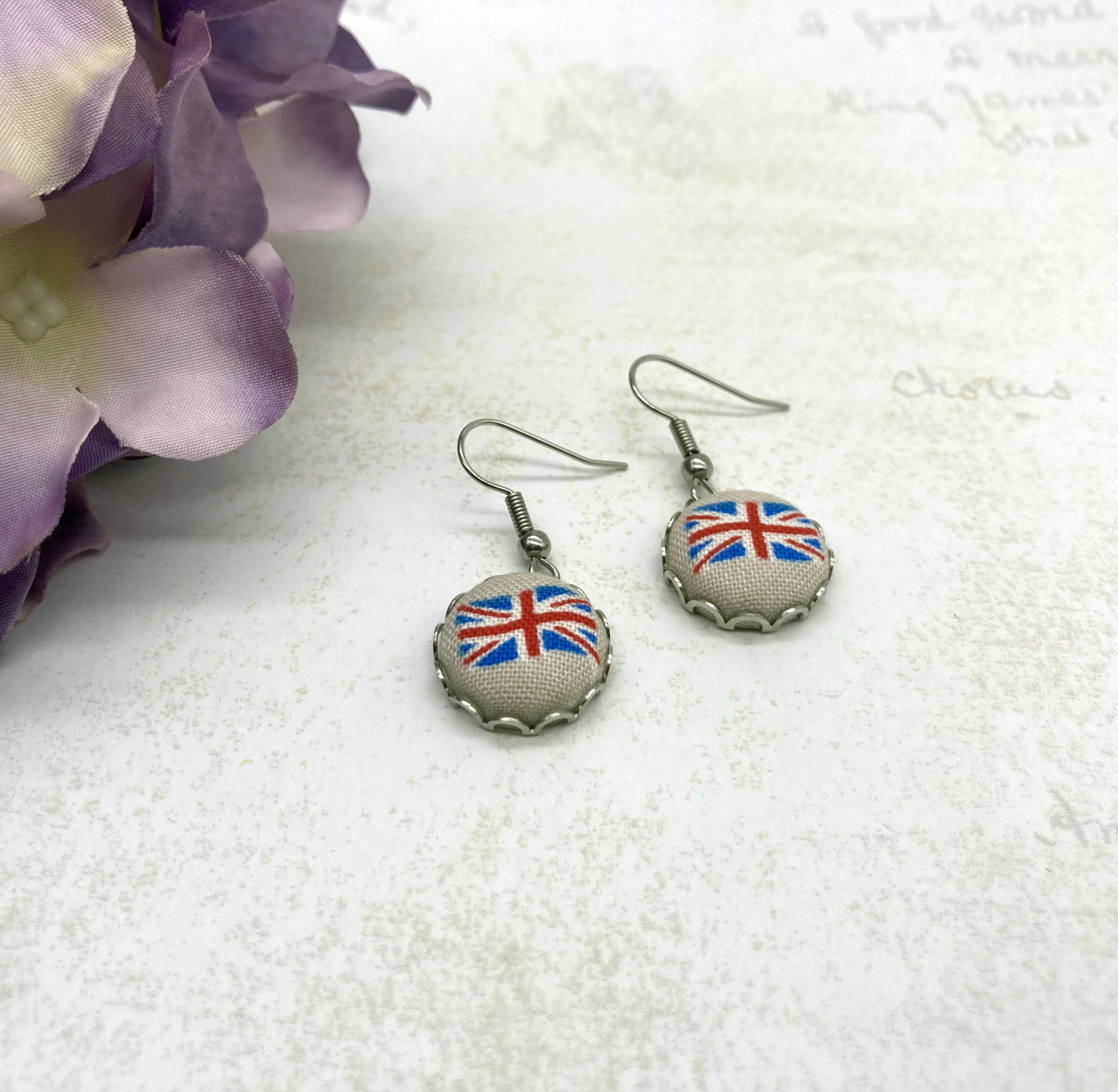 union jack flag ant silv scallop earrings close up