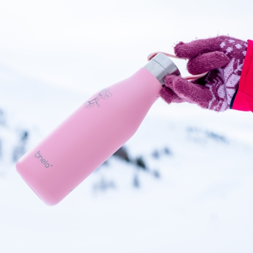 Ohelo insulated pink blossom water bottle with white mountains and snow in background