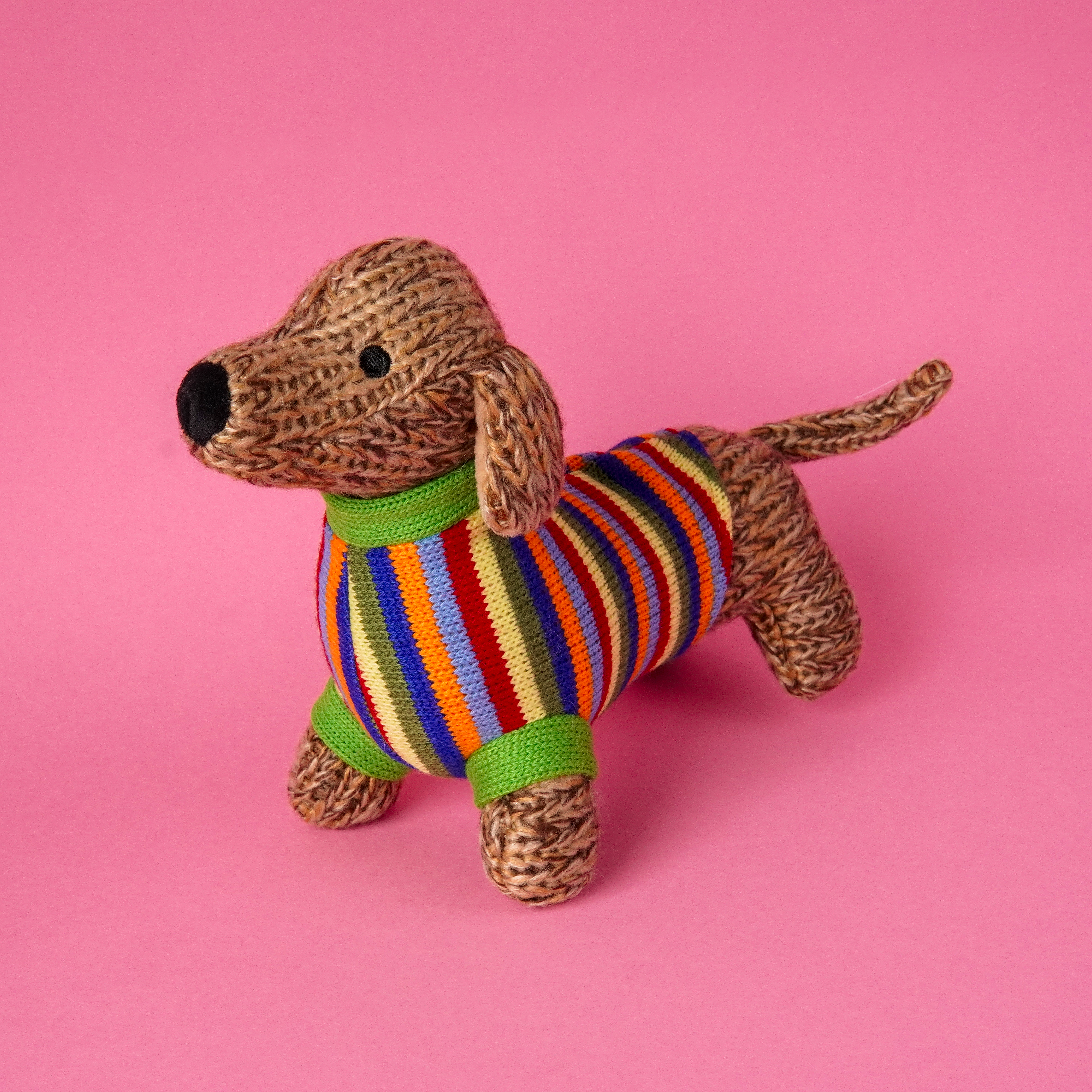 multi_sausage_dog_pink_bg