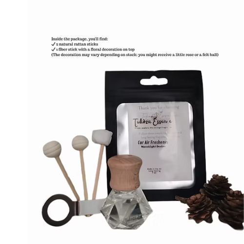 What’s Included – Moonlight Desire Car Air Freshener Set Moonlight Desire car air freshener set displayed with the bottle outside the pouch and three diffuser reeds arranged beside it.