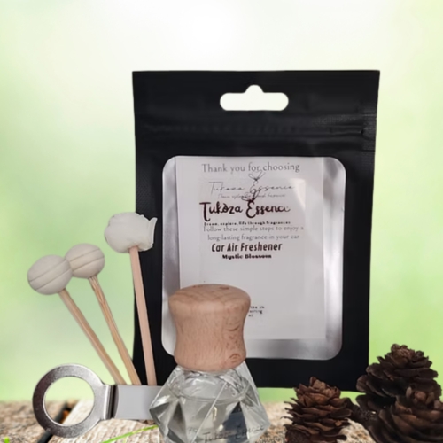 Mystic Blossom car air freshener on a rustic table with three diffuser reeds – elegant and floral presentation