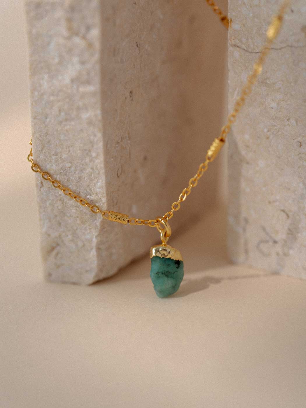 11349689-EMERALD-NECKLACE-CLOSE-ON-ROCK.jpg