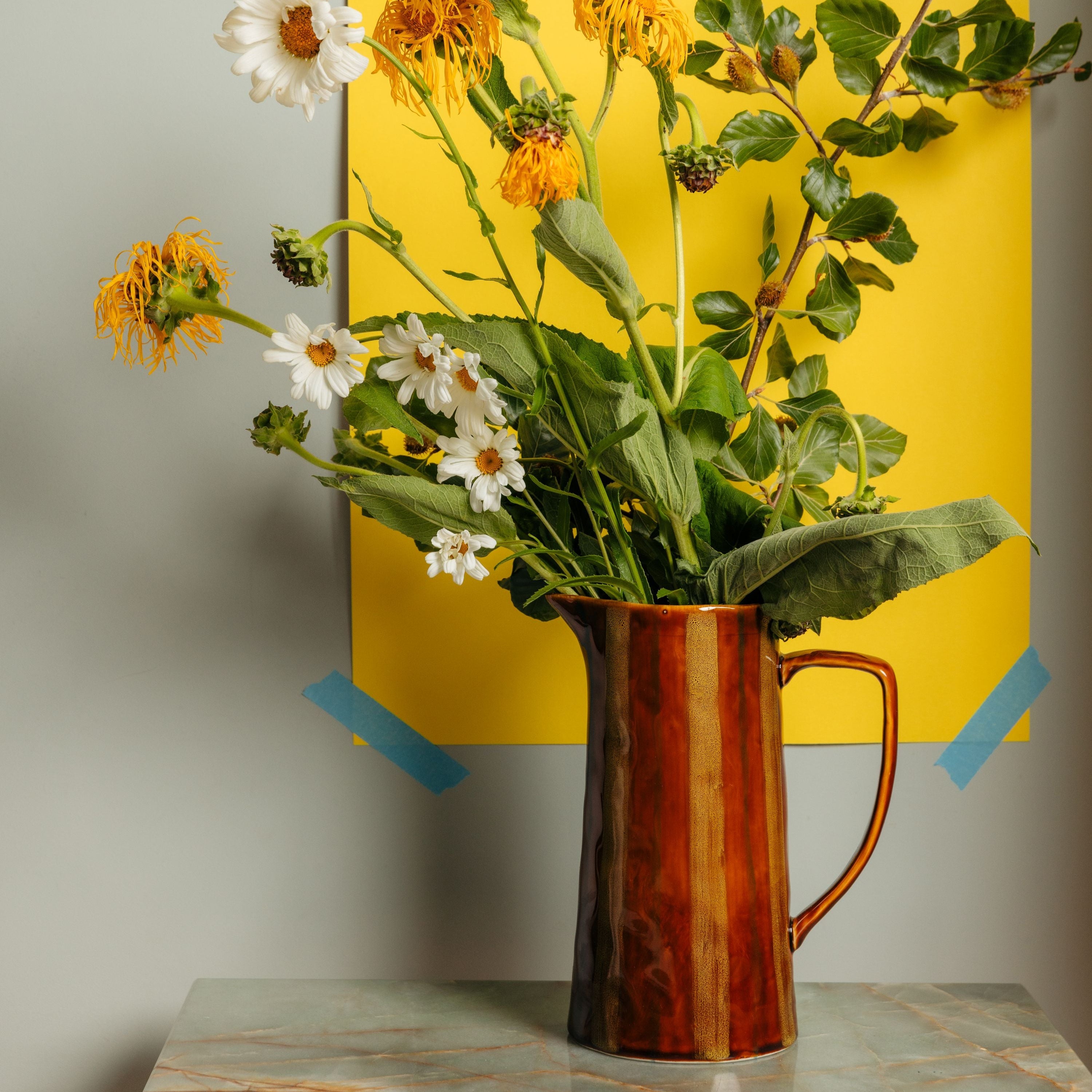 13187615-Brown_Jug_Paper_Still_Life.jpg